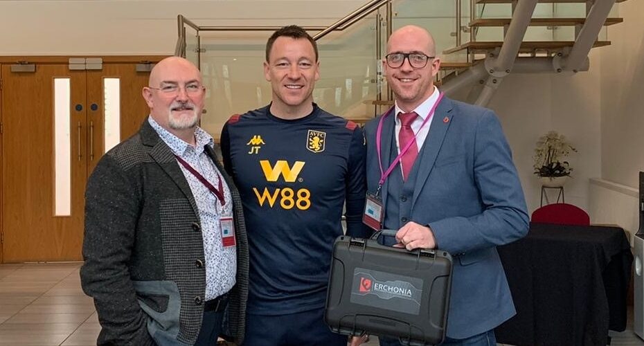 John Terry Holding Erchonia's XLR8 Laser for Getting Rid of Pains